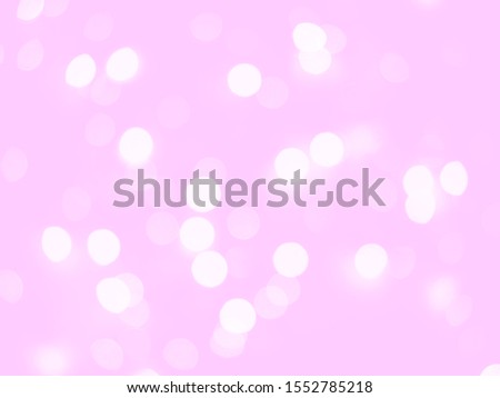 Light pink holiday bokeh background.