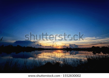 Beautiful sunset sky with reflection on the lake