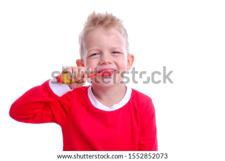 Happy child kid boy brushing teeth on white background. Health care, dental hygiene, people and beauty concept. Mockup, free space.