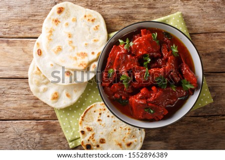 Recipe for Junglee Maas or Jungli Laal Maas close-up in the bowl on the table. Horizontal top view from above Royalty-Free Stock Photo #1552896389