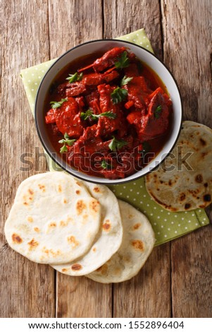 Junglee Maas is a traditional Rajasthani recipe, slowly stewed meat in a spicy sauce close-up on the table. Vertical top view from above
 Royalty-Free Stock Photo #1552896404