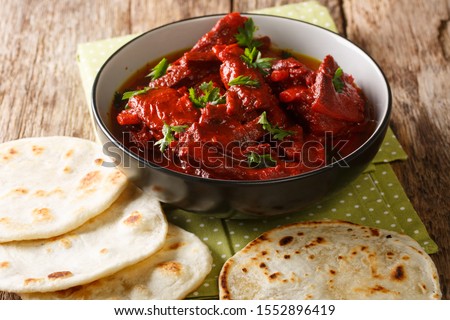 Recipe for Junglee Maas or Jungli Laal Maas close-up in the bowl on the table. horizontal
 Royalty-Free Stock Photo #1552896419