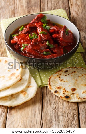 Junglee Maas is a traditional Rajasthani recipe, slowly stewed meat in a spicy sauce close-up on the table. vertical
 Royalty-Free Stock Photo #1552896437