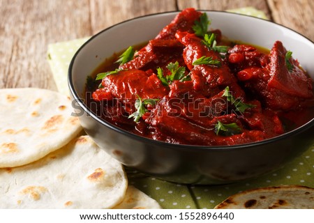 Jungli Laal Maas -A famous dish from Rajasthan - fiery hot mutton dish close-up on the table. horizontal Royalty-Free Stock Photo #1552896440