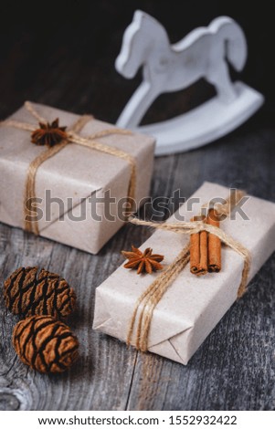 Composition with Christmas gifts on a wooden background. Vertical image.