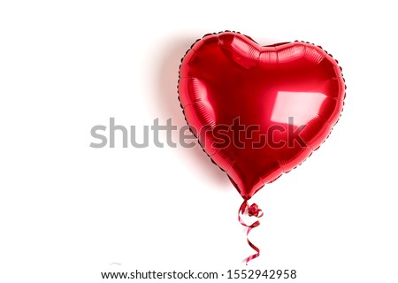 inflatable heart in red color isolated on white background Flat lay Top view Holiday card, Happy Valentine's day concept Love in air Royalty-Free Stock Photo #1552942958