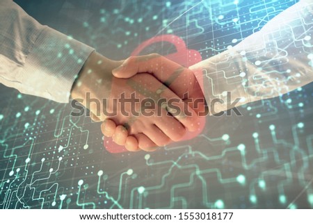 Multi exposure of lock icon drawing on abstract background with two men handshake. Concept of data securitization