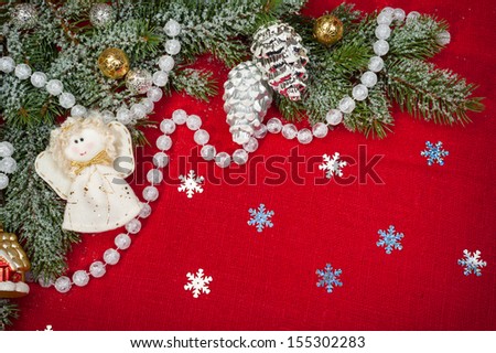 christmas decoration and toys on red textile