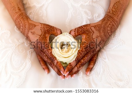 White rose and the engagement rings during a traditional arabic wedding