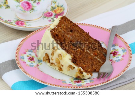 Carrot cake with walnuts and marzipan icing, close up 