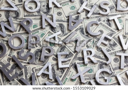 a random metal letters on us dollar background