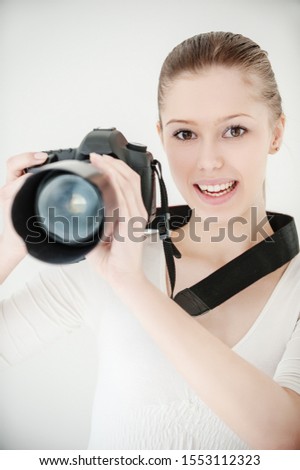 young beautiful smiling woman in a white dress with mirror camera