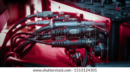 Night club concept. Audio mixer with wires close up. neon light Royalty-Free Stock Photo #1553124305
