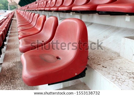 Red chair for watching the sport on the outdoor stadium