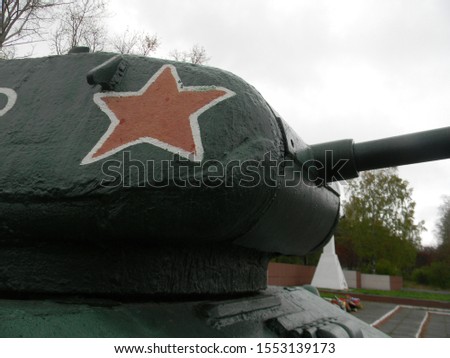 Photo of a background with a fragment of a Soviet tank.

