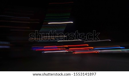 Abstract speed lighting night motion blurry colorful background.