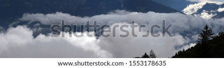 cloud formations in an alpine valley