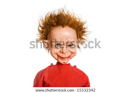 old scary male doll in a studio picture