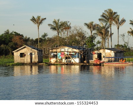 Floating houses on the banks of a tributary of the Rio Negro, Amazonia Brazil