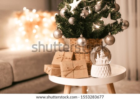 Beautiful decorated christmas tree in cozy interior.