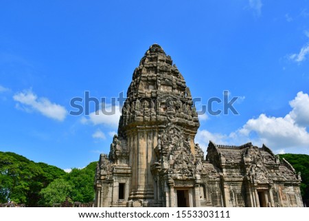Stone castle at Phimai Historical Park with white cloud and blue sky background