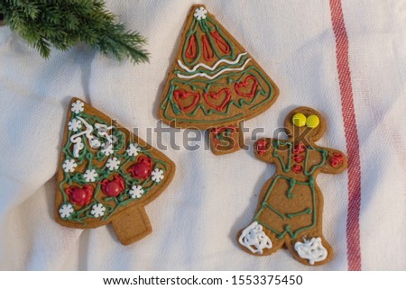 ginger Christmas cookies decorated by children with sugar pencils