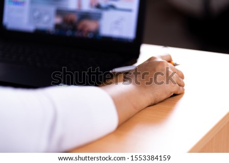 Female hand holding computer mouse