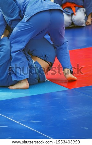Detail from the wrestling match