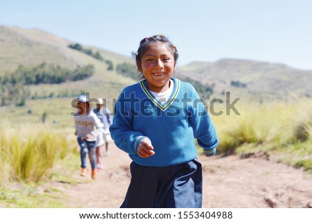 Happy native american 7 years old schoolgirl in the countryside. Royalty-Free Stock Photo #1553404988