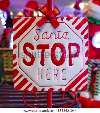 A Santa stop here sign for children to place outside their home or room.                             