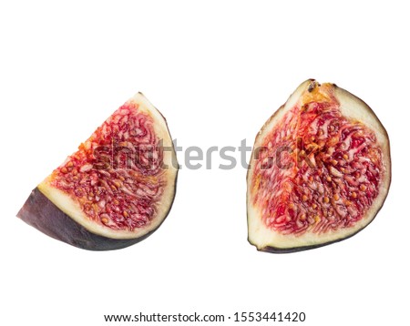 Two slices of purple fig isolated on white background with copy space. Soft, sweet fruit, skin is thin, red flesh has many seeds. Close-up.
