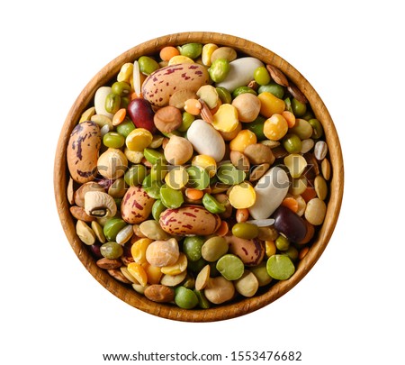 Various dried legumes: lentils bean pea chickpea in a wooden cup top view isolated on white. Royalty-Free Stock Photo #1553476682