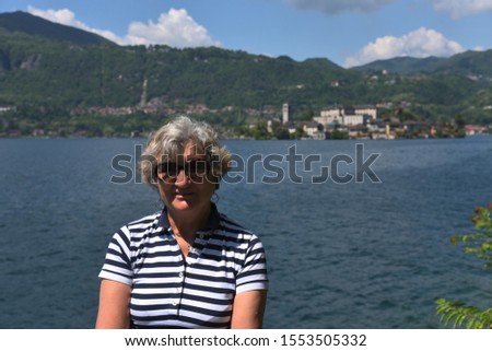 Adult woman on lake Orta, Italy