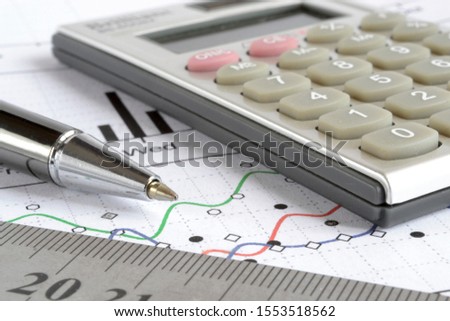 Business background graph, ruler and calculator.