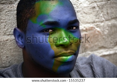 African American Male Portrait With Globe Painted on His Face: Conceptual Montage Image