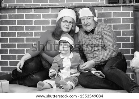 Santa Claus couple with kids Christmas tree
