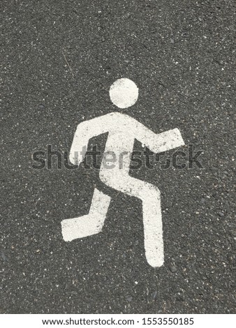 Human work cross walk symbol on the road