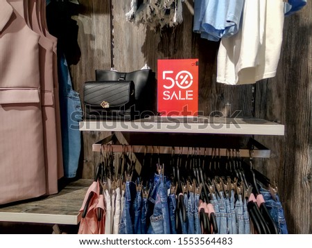 Table tent 50 percent discount on retail clothes shop. Clearance, sale, black friday.