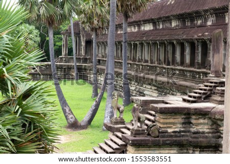 Part of the huge Angkor wat temple in Siem Reap, Cambodia. Picture shows one of the galleries with columns and stone stairs. 