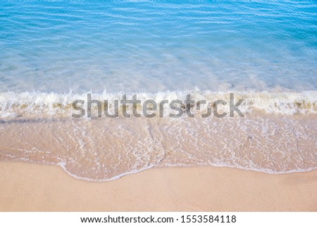 Blue sea wave on the beach summer background