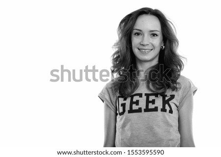 Studio shot of happy geek girl smiling
