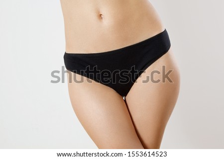Template Blank Close up Black Woman Panties isolated on white background. Cropped image. Flat Belly and nutrition concept. Female health. Pain periods and cycle problems. Front view and copy space