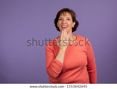 Woman signing thank you using American Sign Language. Hearing impared concept.