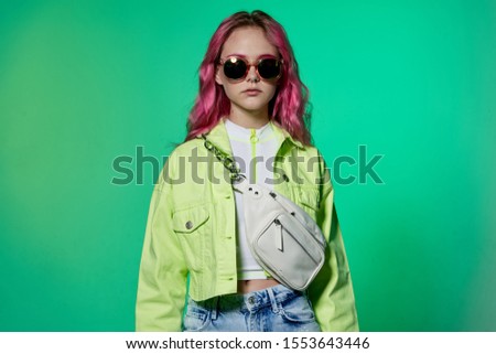 young woman in blue wig isolated background