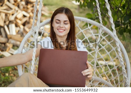 young woman with brown laptop working model
