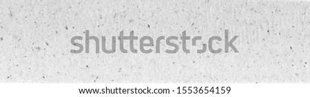 recycled paper texture horizontal background, copy space, textured kraft grunge design, reuse cellulose gray Royalty-Free Stock Photo #1553654159