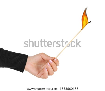 Hand with big burning match isolated on white background