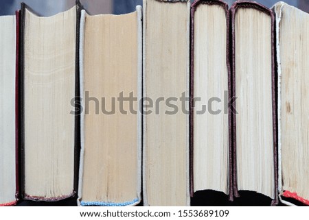A stack of old books close-up. Educational background