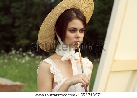 young woman in beautiful hat