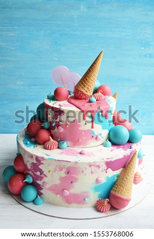 two-tier cake with blue and red balls
